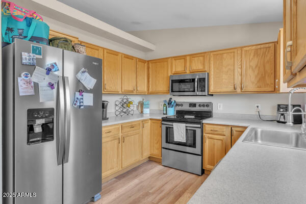138 North Signal Butte Road Apache Junction, AZ 85120 - Photo 8 of 25 a kitchen with stainless steel appliances granite countertop a refrigerator stove microwave and sink