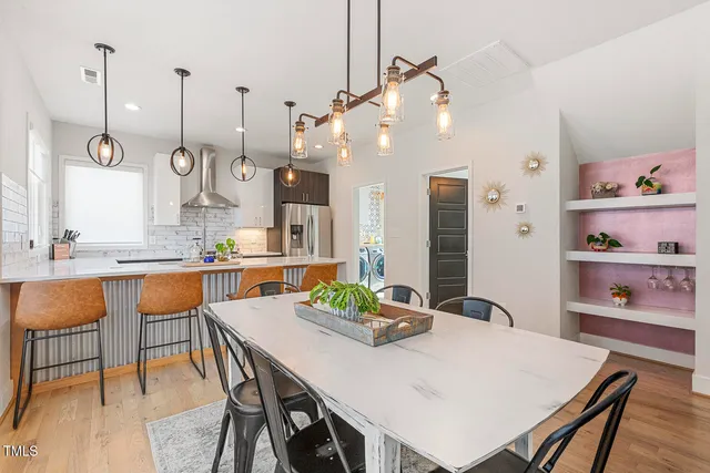 a view of kitchen island dining table and chairs