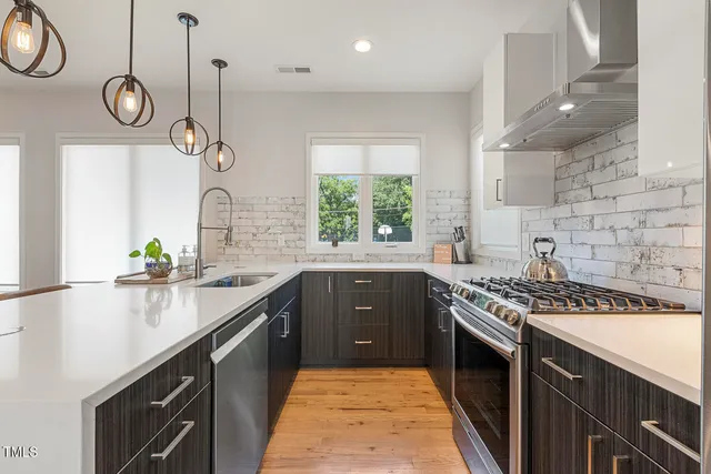 a kitchen with a sink and a stove