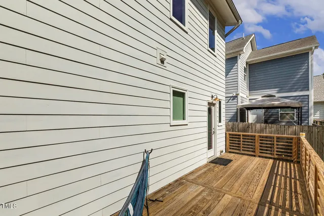 a view of a balcony with wooden floor and floor