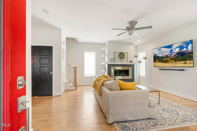 a living room with furniture and a fireplace