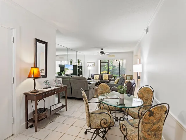 a view of a dining room and a table and chairs in a room