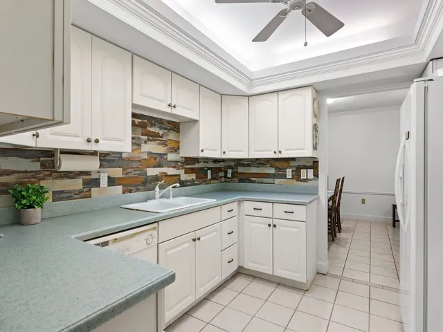 a kitchen with cabinets appliances and a counter top
