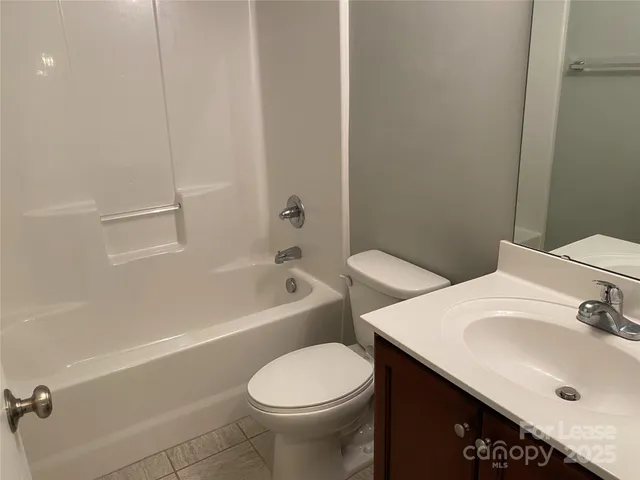a bathroom with a sink toilet and vanity