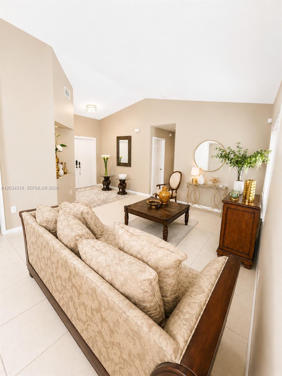 14856 Southwest 179th Street Miami, FL 33187 - Photo 7 of 33 a living room with furniture