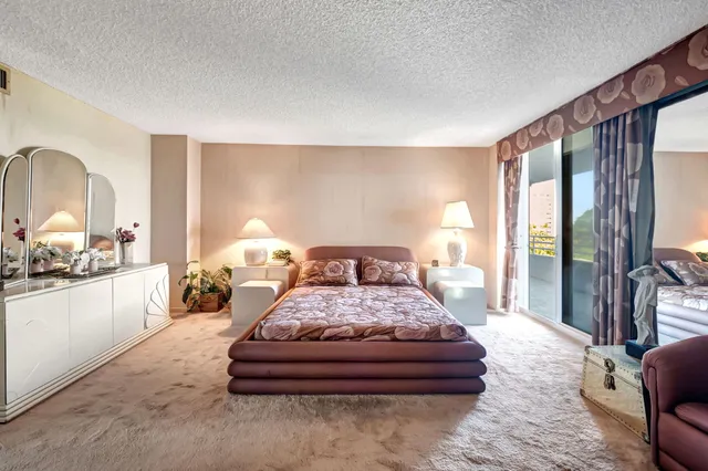 a bedroom with bed and window