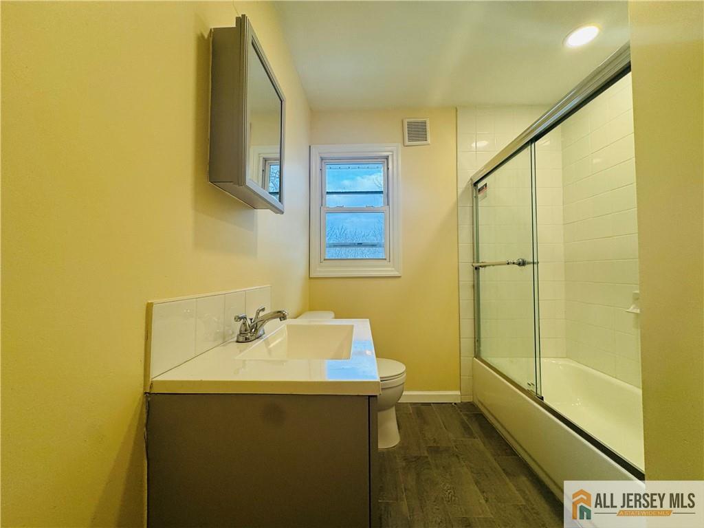1868 Oak Tree Road Edison, NJ 08820 - Photo 14 of 24 a bathroom with a sink and a mirror