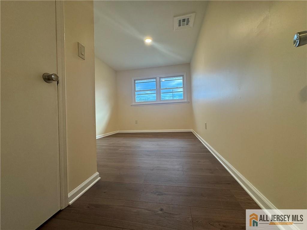 1868 Oak Tree Road Edison, NJ 08820 - Photo 15 of 24 an empty room with wooden floor and windows