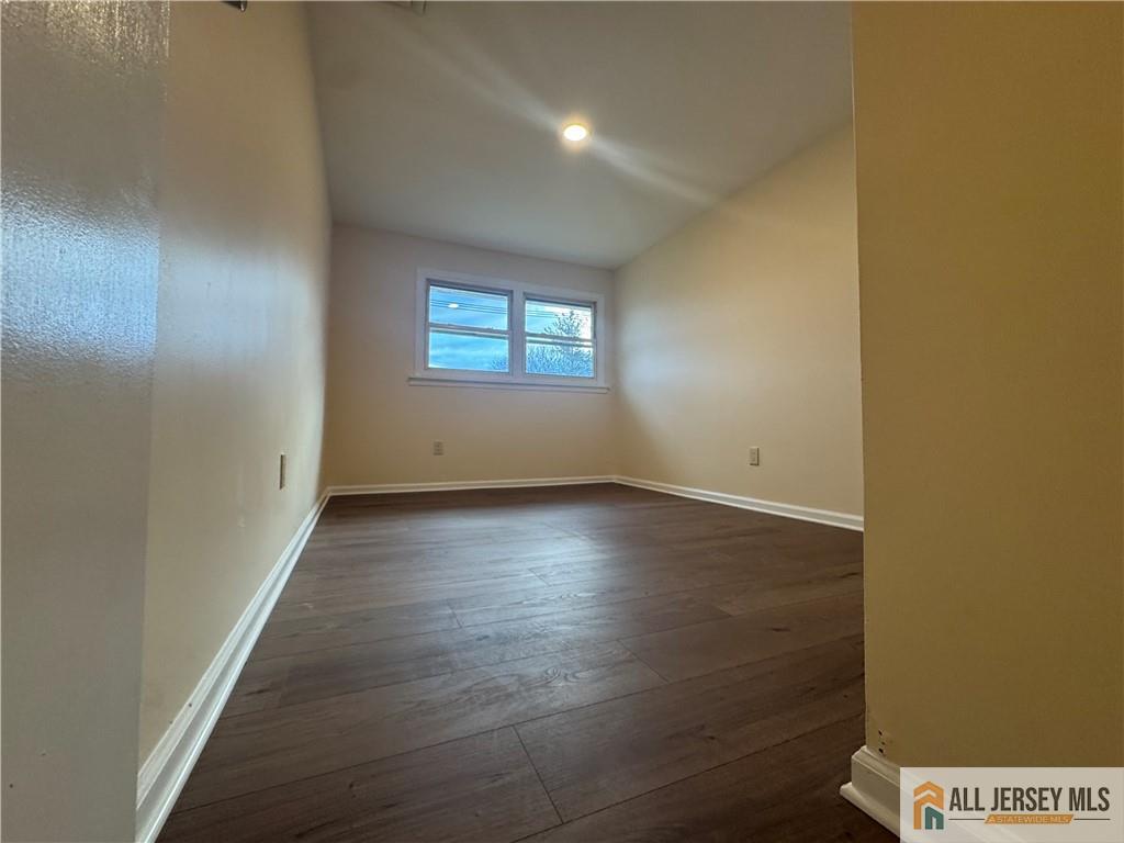 1868 Oak Tree Road Edison, NJ 08820 - Photo 16 of 24 an empty room with wooden floor and windows