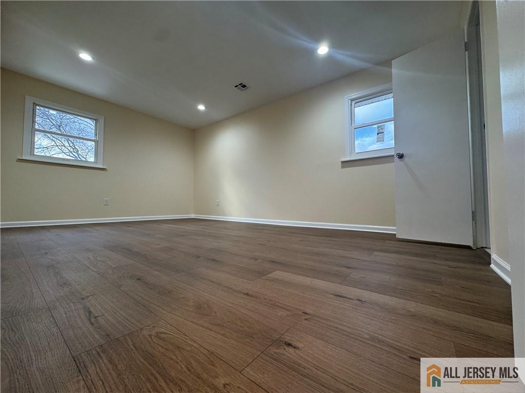 1868 Oak Tree Road Edison, NJ 08820 - Photo 17 of 24 an empty room with wooden floor and windows