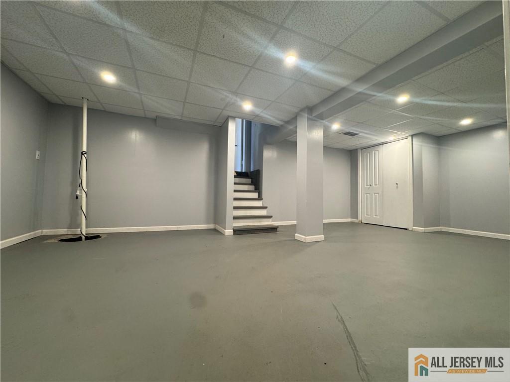 1868 Oak Tree Road Edison, NJ 08820 - Photo 21 of 24 an empty room with a staircase