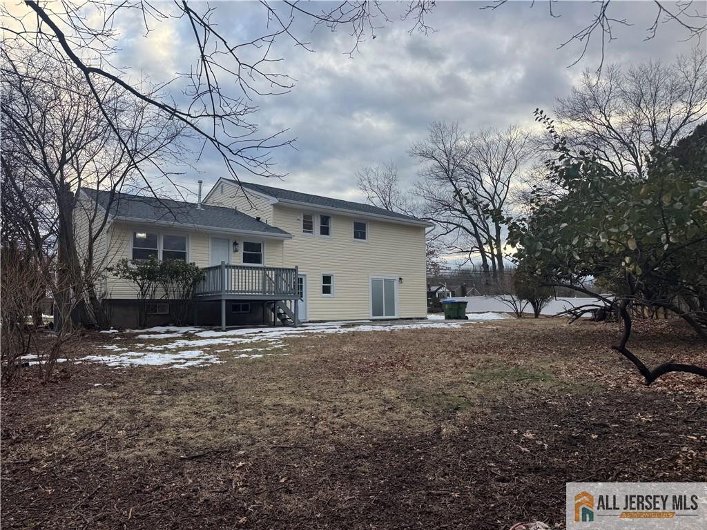 1868 Oak Tree Road Edison, NJ 08820 - Photo 24 of 24 a view of a house with a yard covered in snow