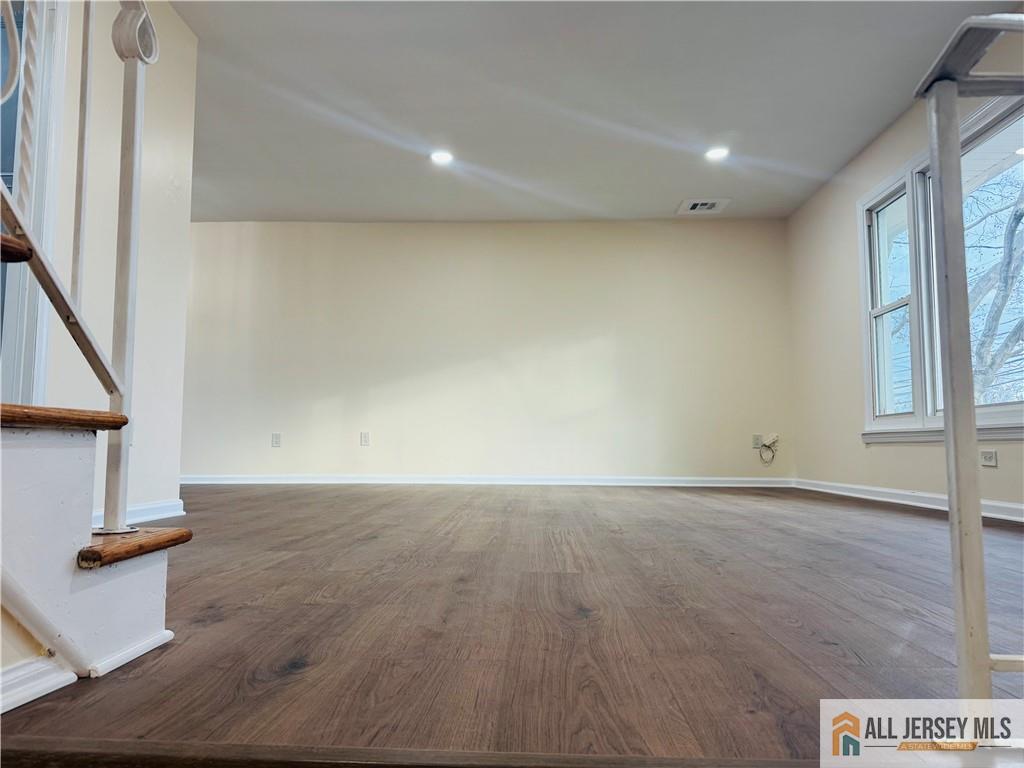 1868 Oak Tree Road Edison, NJ 08820 - Photo 5 of 24 an empty room with wooden floor and windows