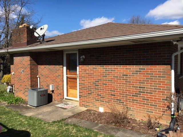1622 Rostraver Road Belle Vernon, PA 15012 - Photo 20 of 24 View of Side of Home from Kitchen. Sidewalk to rear Patio.