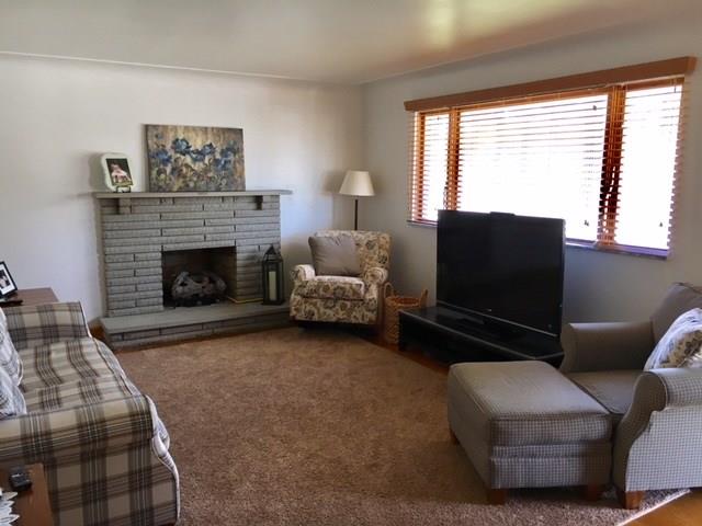 1622 Rostraver Road Belle Vernon, PA 15012 - Photo 6 of 24 Living Room view showcasing Wooden Blinds and Gas Fireplace.