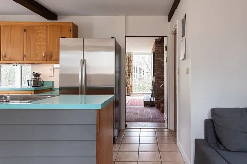 a bathroom with a tub and shower