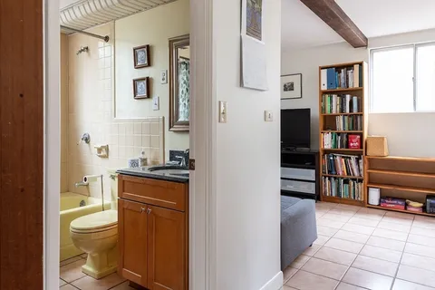 a bathroom with a toilet a sink and a shower