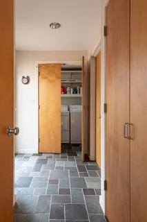 a view of a hallway with a door
