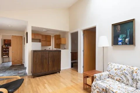 a bedroom with a bed and a mirror