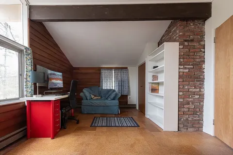 a view of livingroom with furniture and windows