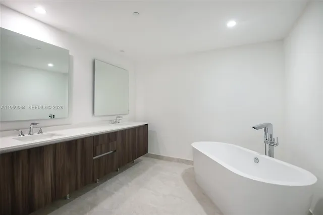 a bathroom with a toilet a sink a shower and a window