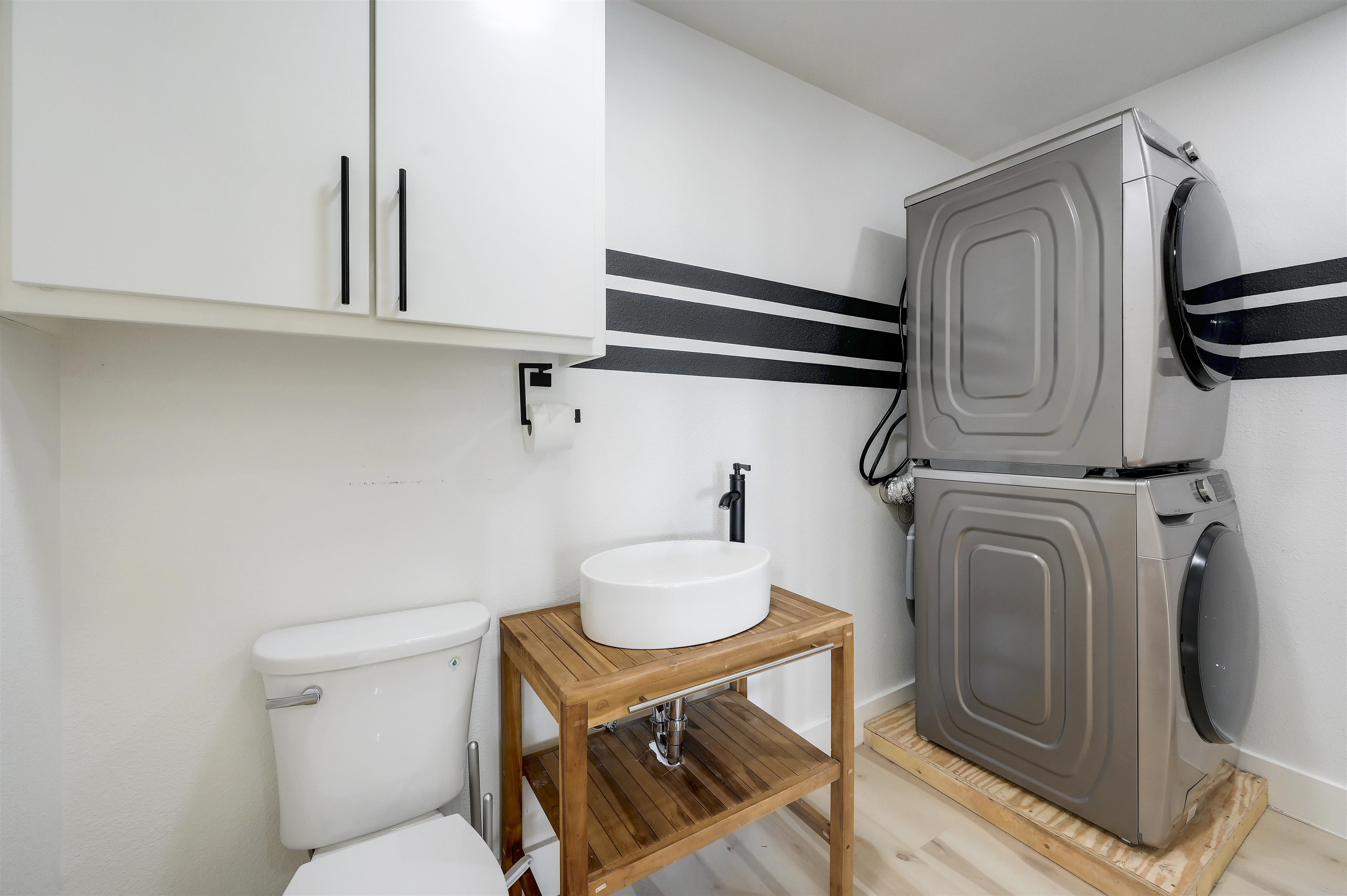 4100 Rm 690 Burnet, TX 78611 - Photo 16 of 30 a bathroom with a toilet a sink and mirror