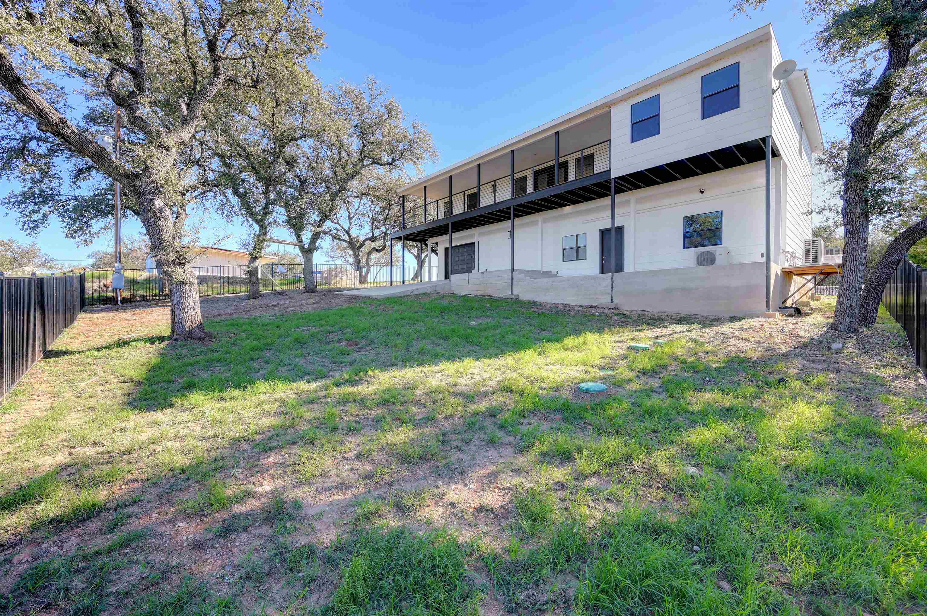 4100 Rm 690 Burnet, TX 78611 - Photo 22 of 30 a house view with a sitting space and garden