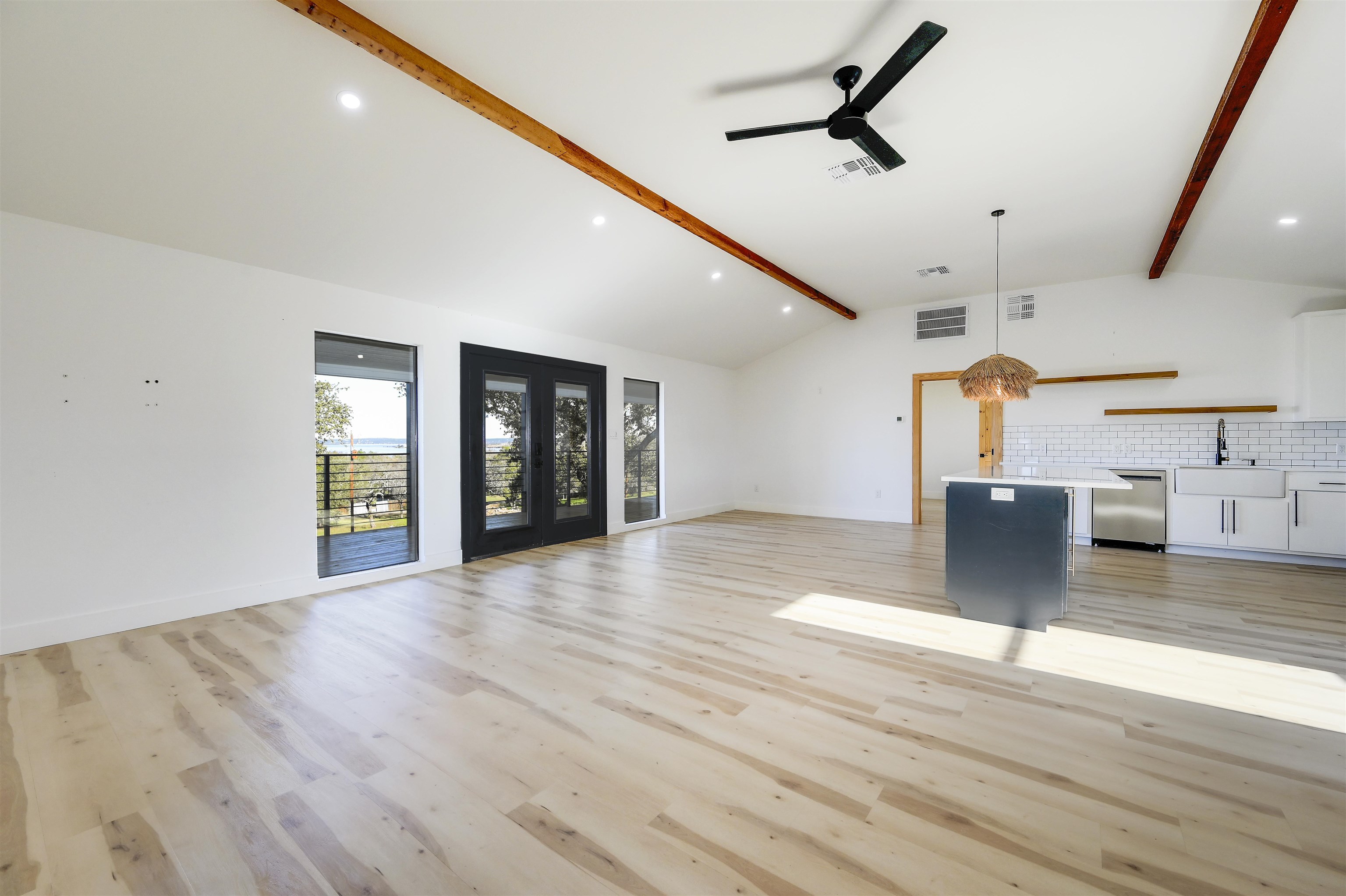 4100 Rm 690 Burnet, TX 78611 - Photo 6 of 30 a view of a living room a kitchen and a wooden floor