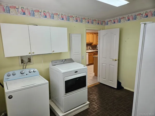 a utility room with dryer and washer