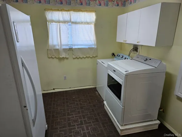a utility room with a window dryer and washer