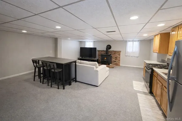 a kitchen with furniture and window