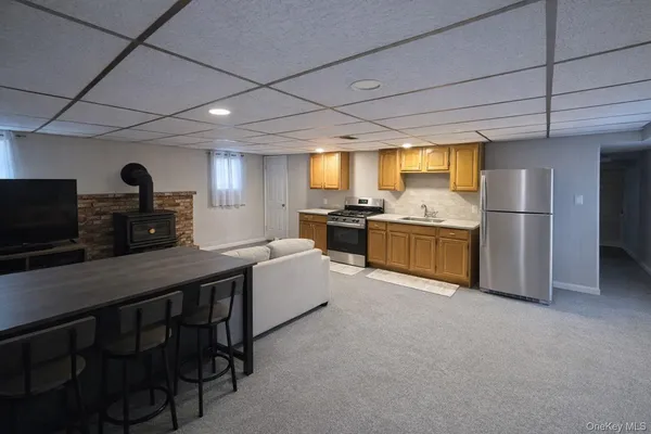 a kitchen with cabinets and stainless steel appliances