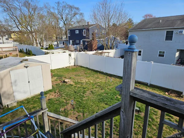 a view of a backyard with sitting area