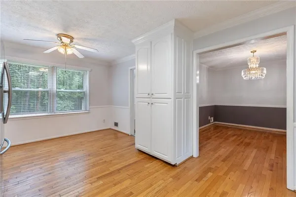 a kitchen with stainless steel appliances a refrigerator and a stove top oven