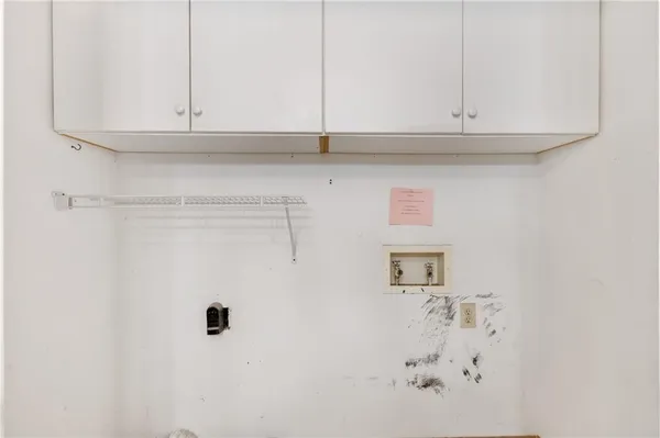 an empty room with a ceiling fan and window