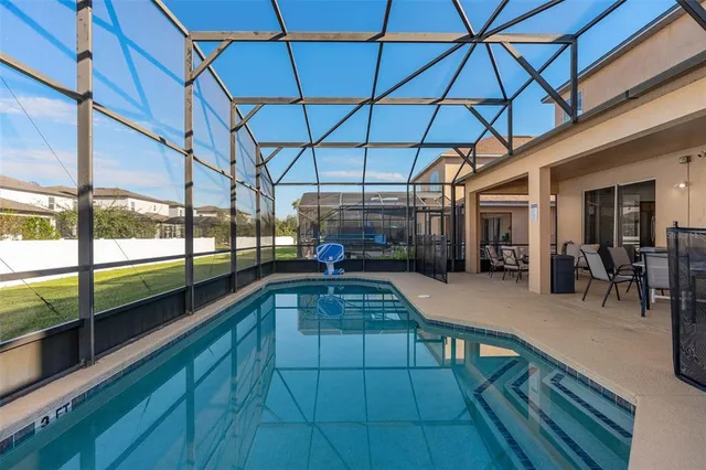 a view of a swimming pool with a porch
