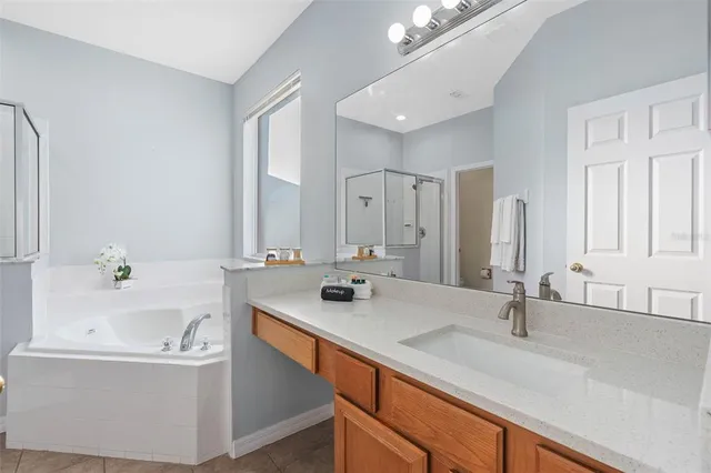 a bathroom with a sink toilet and a mirror