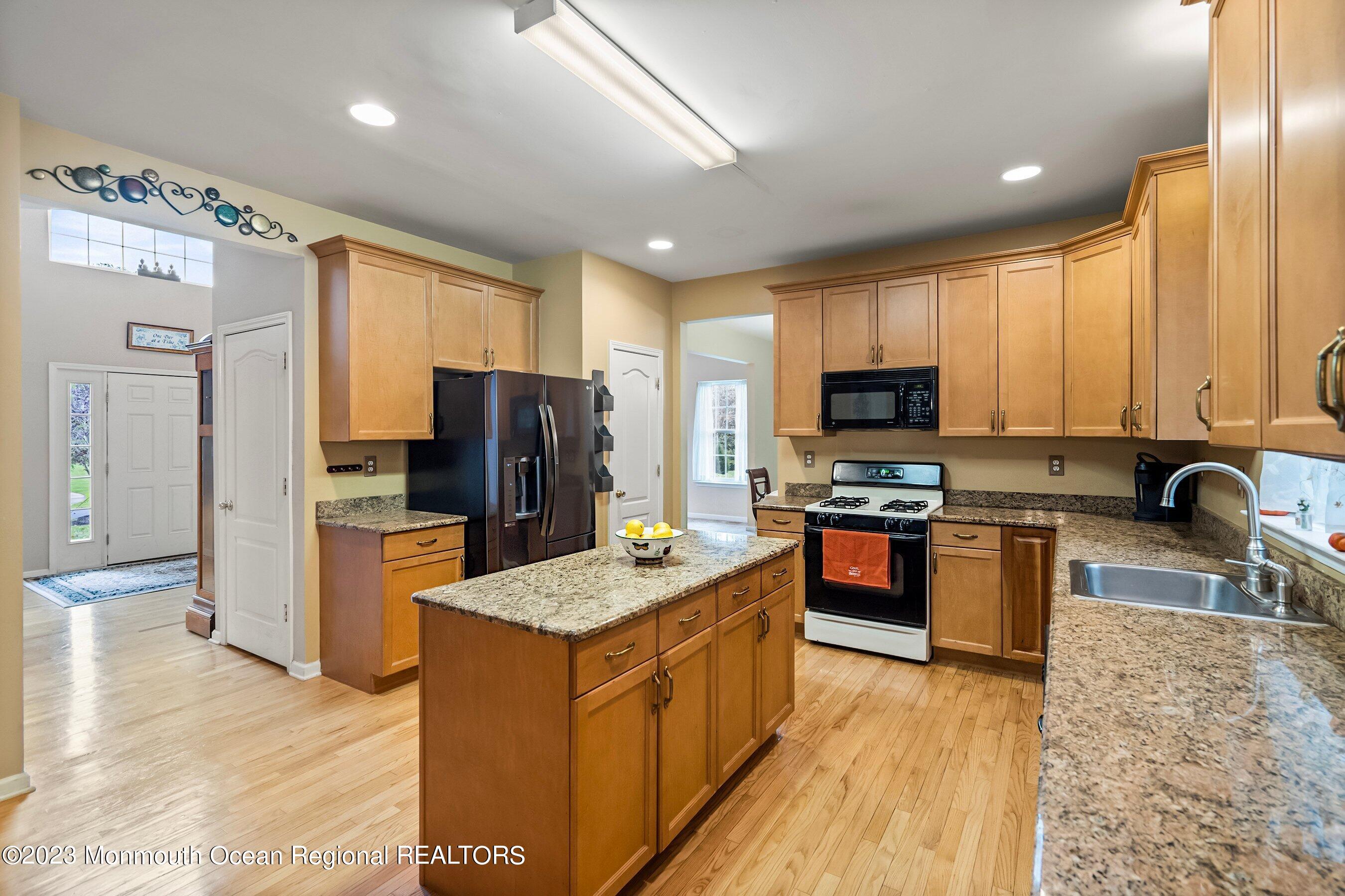 30 Cedar Knoll Road Jackson, NJ 08527 - Photo 15 of 24 a kitchen with stainless steel appliances granite countertop a stove refrigerator sink and dishwasher