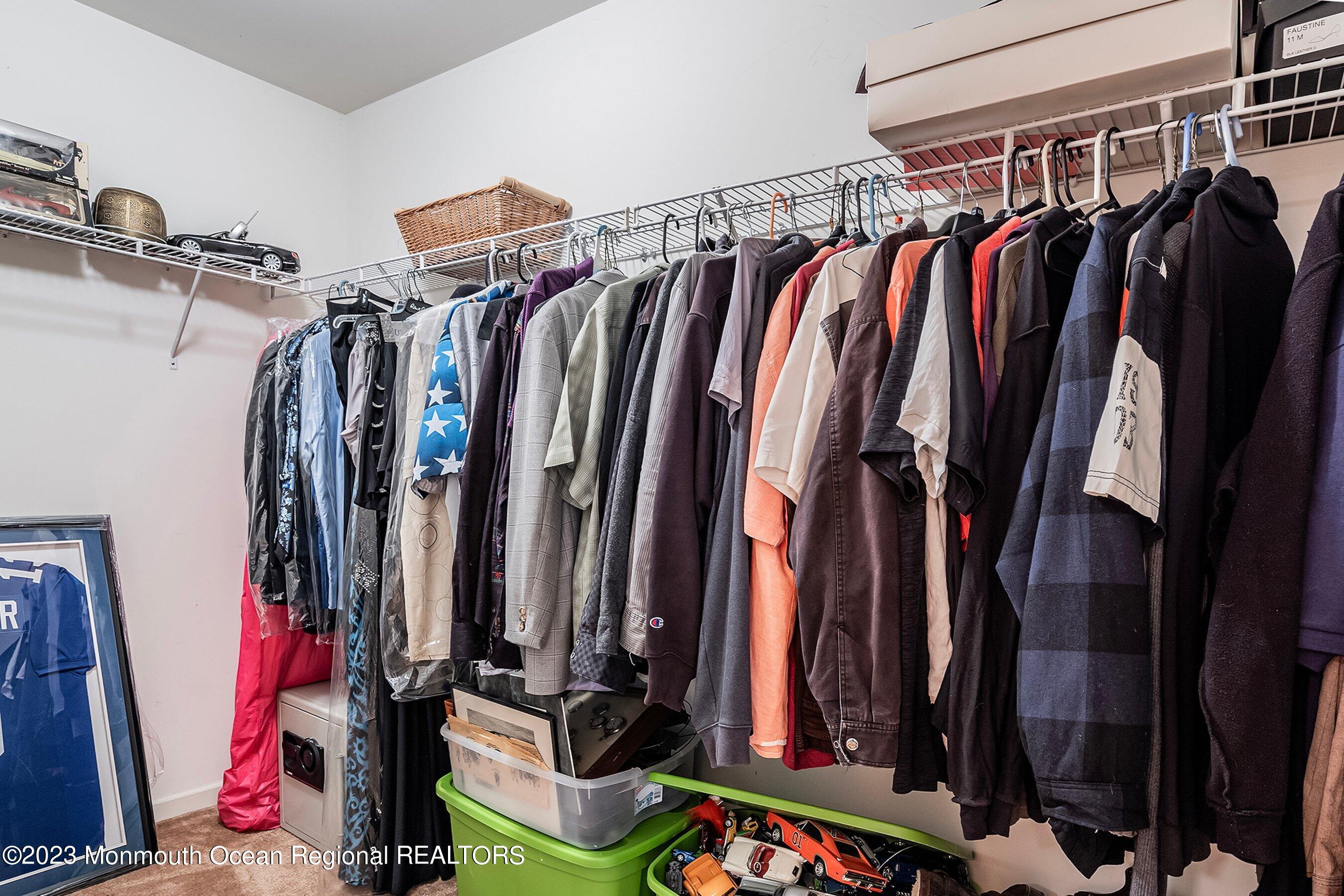 30 Cedar Knoll Road Jackson, NJ 08527 - Photo 20 of 24 a view of walk in closet with clothes and shoes