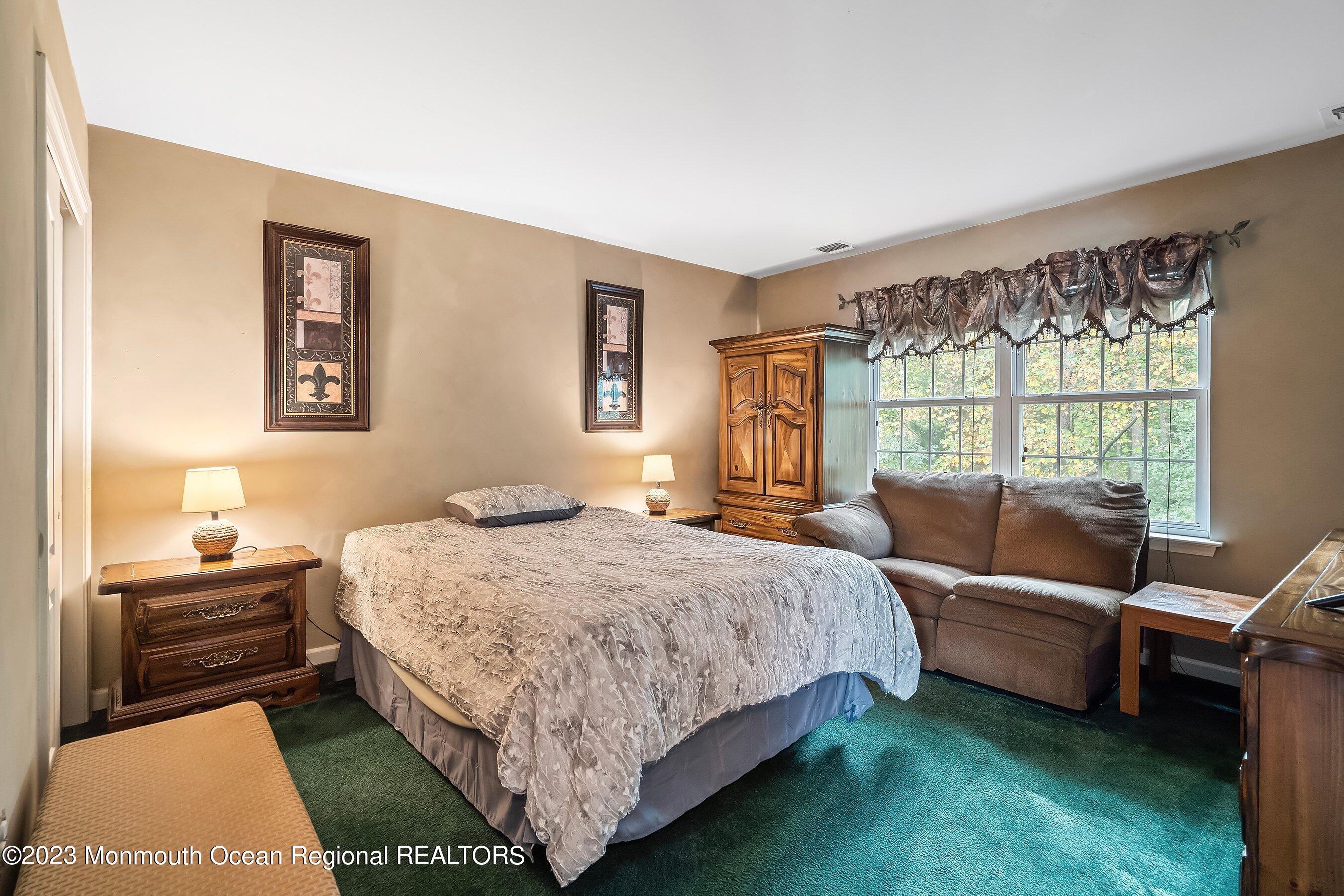 30 Cedar Knoll Road Jackson, NJ 08527 - Photo 22 of 24 a bedroom with a bed and a window
