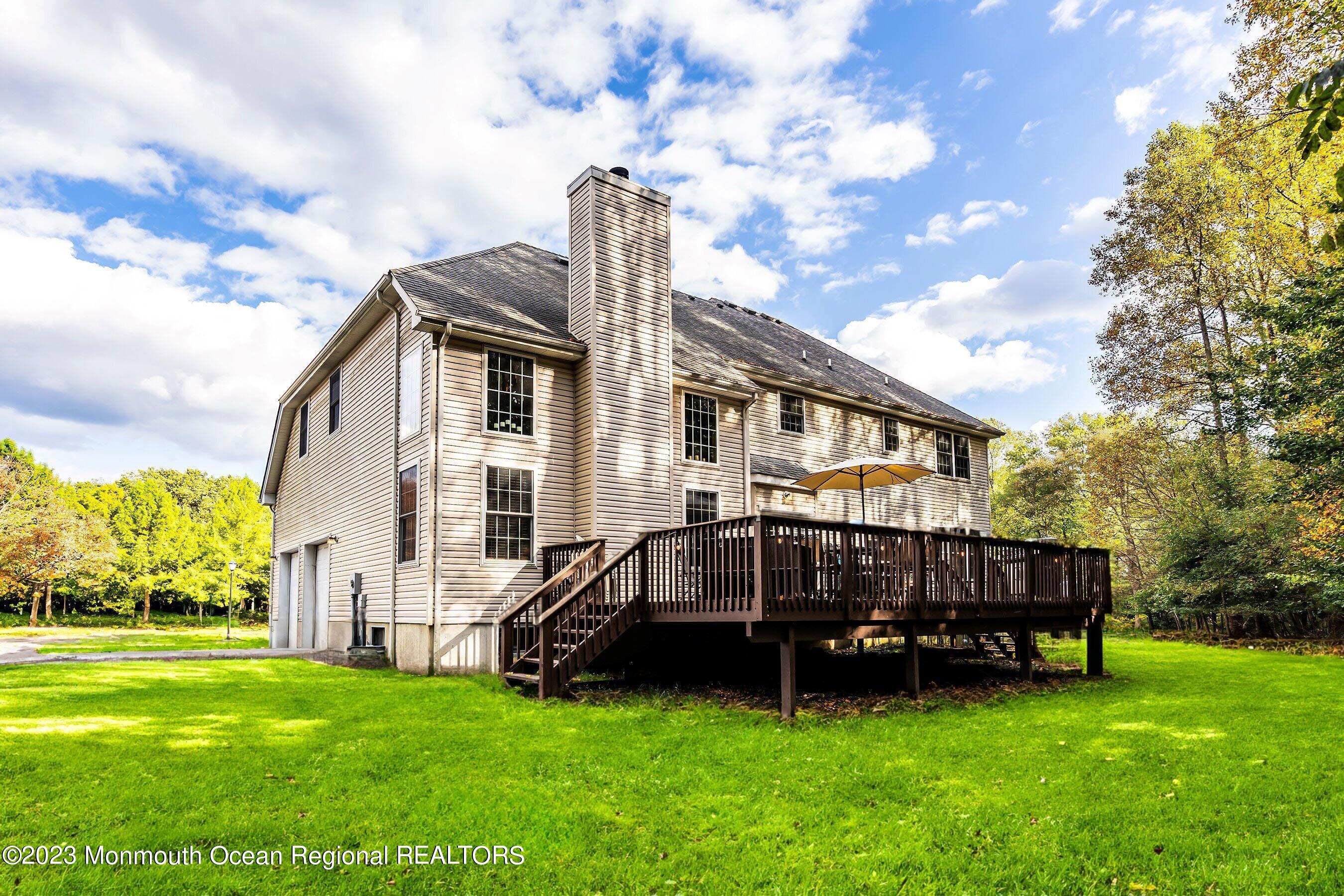 30 Cedar Knoll Road Jackson, NJ 08527 - Photo 6 of 24 a view of a house with a backyard and deck