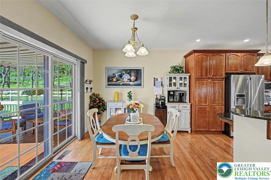 112 Michaels Run Road Stroudsburg, PA 18360 - Photo 20 of 69 The Breakfast Nook has hardwood floors, 9' ceiling with chandelier and sliders that lead out to the back deck.