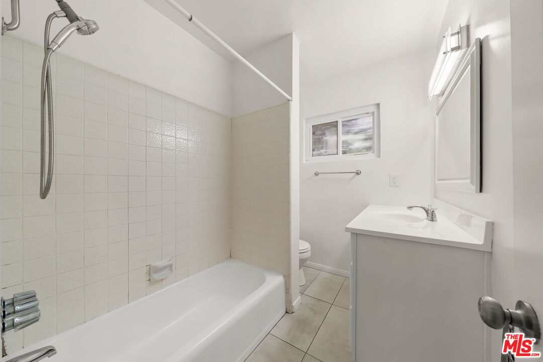 1517 Harvard Street, Unit 3 Santa Monica, CA 90404 - Photo 17 of 20 a bathroom with a sink and a bathtub