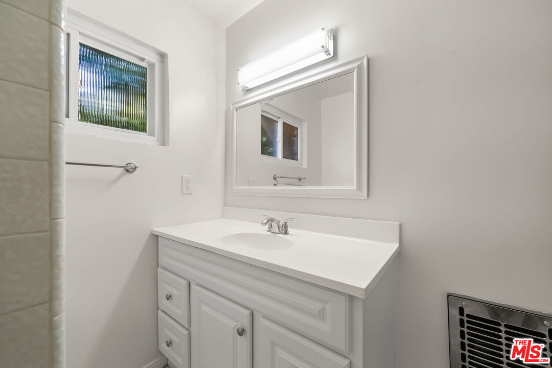 1517 Harvard Street, Unit 3 Santa Monica, CA 90404 - Photo 18 of 20 a bathroom with a sink and a mirror