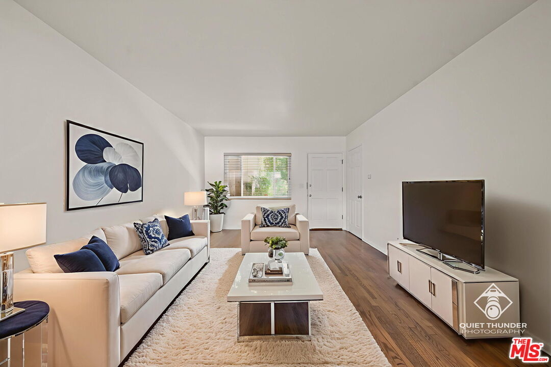 1517 Harvard Street, Unit 3 Santa Monica, CA 90404 - Photo 7 of 20 a living room with furniture and a flat screen tv