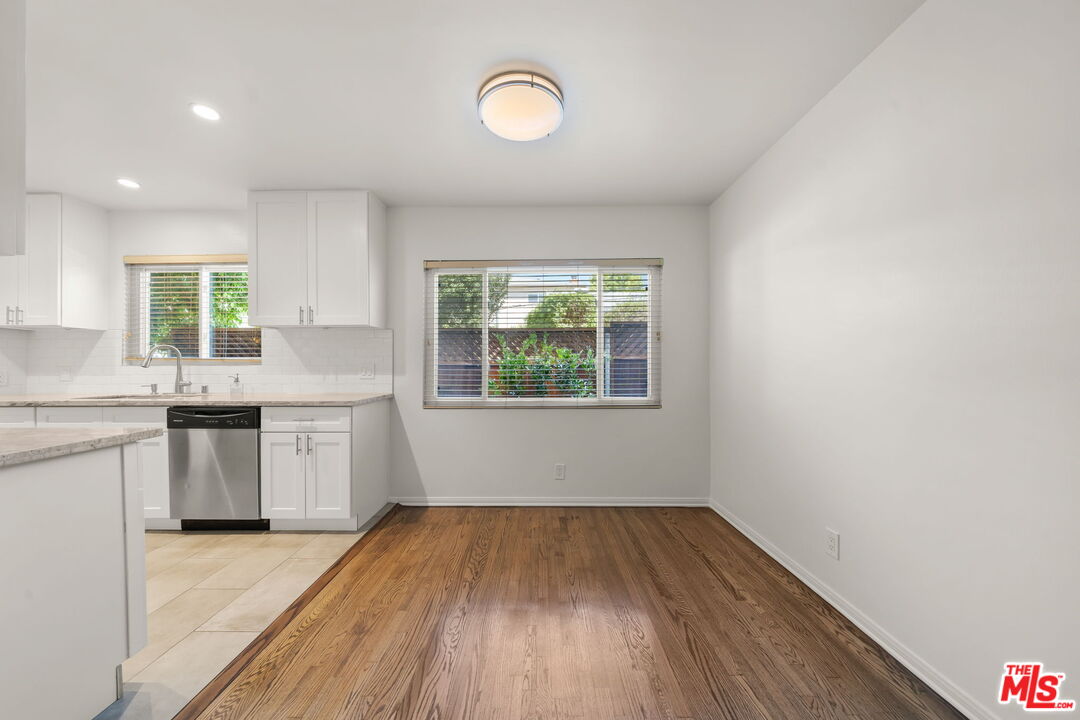 1517 Harvard Street, Unit 3 Santa Monica, CA 90404 - Photo 9 of 20 a kitchen with wooden floors and window