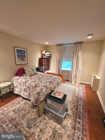a bedroom with a large bed and a table
