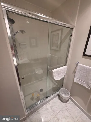 a bathroom with a granite countertop sink mirror and toilet