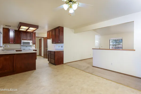 a kitchen with stainless steel appliances a refrigerator and a stove