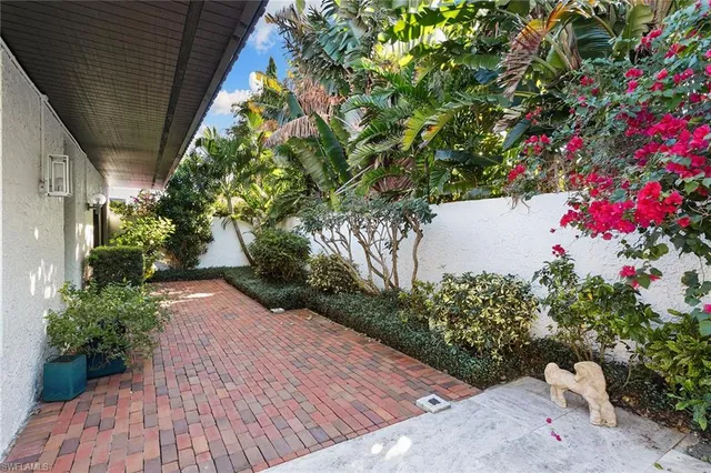 a view of a backyard with sitting area